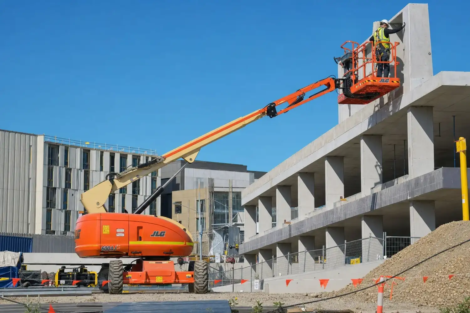 Worker in the basket of an elevated work platform on an Australian construction site