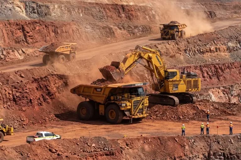 Large mining haul truck and excavator operating in an Australian open pit mine
