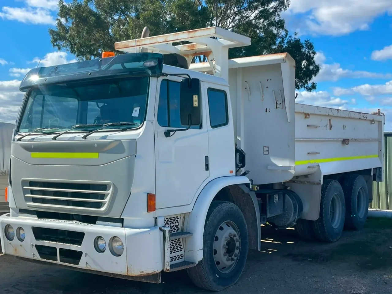 White tipper truck parked at an Australian yard