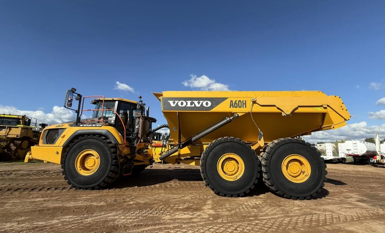 Yellow Volvo A60H articulated dump truck parked side-on at an Australian machinery yard